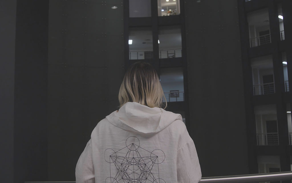 Minimalist hoodie design featuring geometric back graphic in oversized fit for clean aesthetic ideas